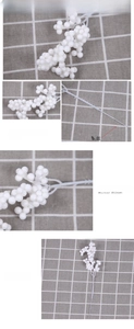 Detail of faux white Christmas berries with foam texture and realistic branch stems