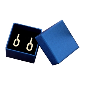 Golden geometric oval earrings presented in a peacock blue textured jewelry gift box