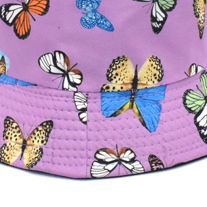 Reversible lavender sun bucket hat with colorful butterfly print and stitching details