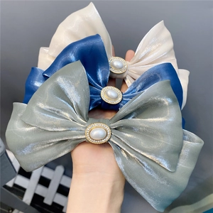 Double-layered silk bow hair clip with faux pearl and rhinestone center in three colors