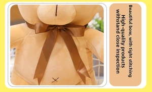 Close-up of teddy bear with brown satin bow and detailed handmade stitching on chest