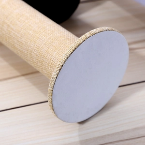 Macro detail of high-quality velvet display stand showing fabric texture and base