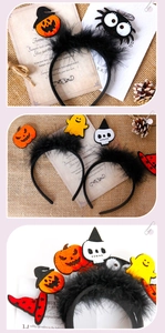 Close-up of Halloween headband with black feathers and festive felt pumpkin charms