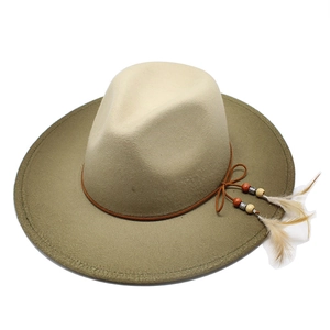 Detail of felt fedora hat featuring beaded cords and two white feathers decoration