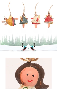 Detailed view of hand-painted metal angel ornaments with rustic finish and jute ropes