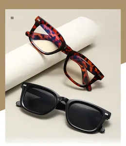 Close-up of square plastic sunglasses with metal rivets and polarized lenses on props