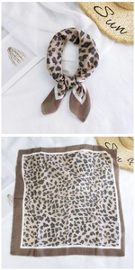 Flat lay and knotted display of leopard print linen scarf with brown and beige patterns