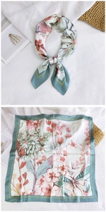 Detailed view of square silk scarf with floral and butterfly prints in grey-green and pink