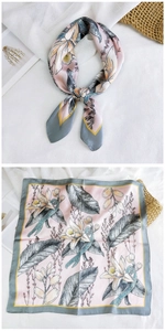 Macro detail of silk feel square scarf with elegant pink orchid prints and rolled edges