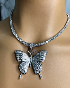 Detail of silver butterfly pendant with white rhinestones on a sparkling tennis choker chain