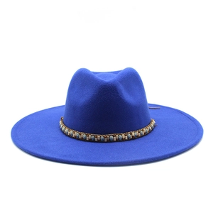 Close-up of royal blue wide brim fedora hat with ethnic colorful beaded hatband detail