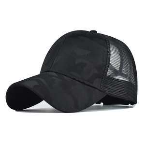Close-up of black camo pattern and breathable mesh back on the outdoor trucker hat