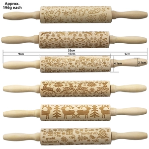 Detailed view of 35cm embossed wooden rolling pin with laser-engraved reindeer patterns