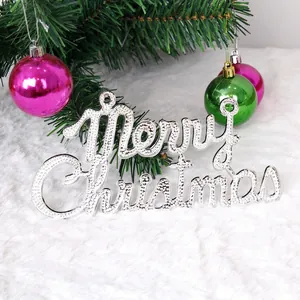 Silver Merry Christmas hanging sign ornament with glitter texture on a festive tree