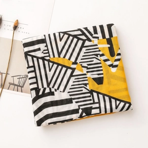 Lightweight geometric striped sun protection shawl in yellow and black pattern