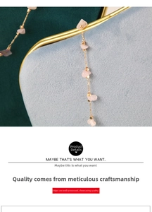 Detailed macro view of the gold chain necklace with pink quartz fragments on blue velvet