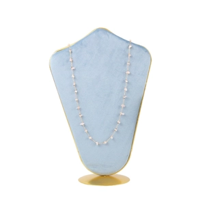Pink stone beaded necklace displayed on a light blue velvet mannequin with gold base