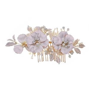 Floral bridal hair comb with gold leaves pearls and rhinestones for wedding styling