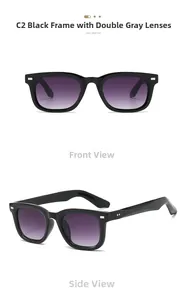 Detail view of square black plastic sunglasses with gradient lenses and silver rivet accents