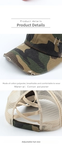 Detail of camo baseball cap with distressed brim, mesh back, and adjustable velcro strap