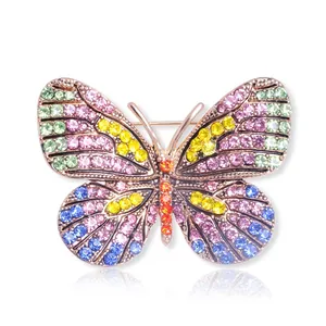 Elegant butterfly brooch with multicolor rhinestones and alloy base on white background