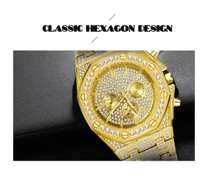Detailed view of the luxury gold iced-out chronograph watch with a classic hexagon bezel