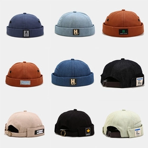 Multiple colors of cotton docker caps with adjustable metal buckles in a grid view