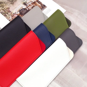 Minimalist PU leather sunglasses pouches in various colors on marble background
