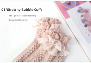 Close-up of pink girls' socks with elastic bubble cuffs and delicate lace ruffles