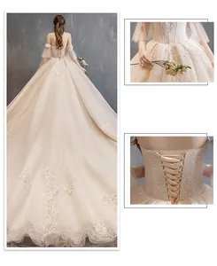Detail of champagne bridal gown featuring adjustable corset lace-up back and cinched waist