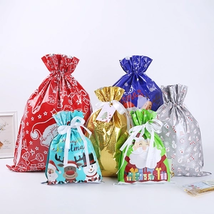 Holographic Christmas drawstring gift bags with Santa and snowman patterns in multiple colors