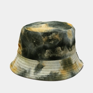 Detailed close-up of tie-dye corduroy fabric texture on a stylish reversible bucket hat