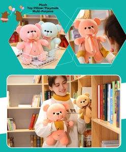 Detailed view of colorful plush teddy bears with silk bows in various pastel colors