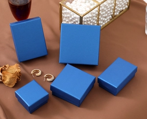 Macro shot of peacock blue jewelry gift boxes with matte texture for rings and earrings