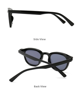 Detail view of black vintage sunglasses showing side frames and folded back structure
