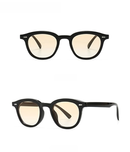 Detail view of vintage narrow black frames with gradient yellow lenses from multiple angles