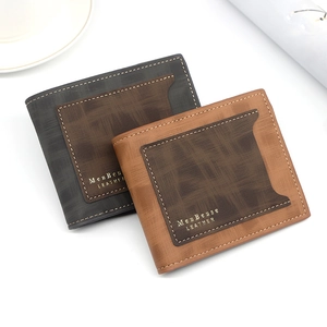 Flat lay of gray and brown bifold wallets with gold logo and textured leather finish