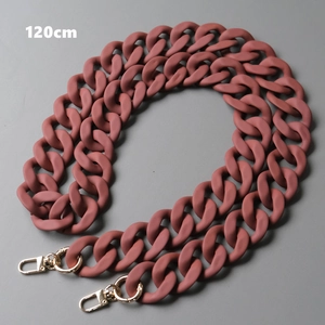 Close-up of matte brick red acrylic handbag chain strap with gold lobster clasps 120cm
