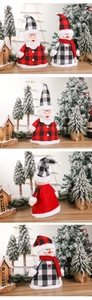 Detail of Santa and snowman plush decorations featuring festive red and black plaid patterns