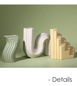 Gros plan de vases en céramique minimalistes en vert pastel, blanc et jaune mat