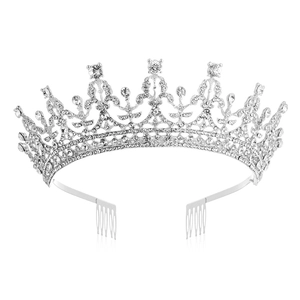 Detail of silver bridal crown showing sparkling crystals and hair combs on white background