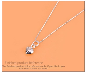 Polished S925 sterling silver heart pendant necklace on a vibrant orange background