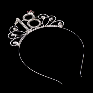 Detailed close-up of a silver rhinestone crown headband featuring pink gems and number 18