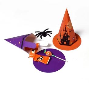 Close-up of Halloween witch hat paper gift boxes in orange and purple for candy storage