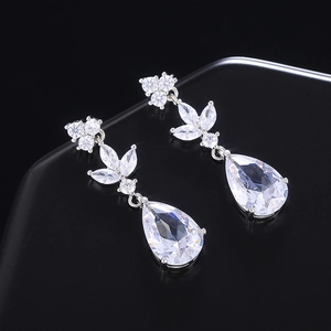 Detail view of teardrop and marquise cut cubic zirconia drop earrings in silver