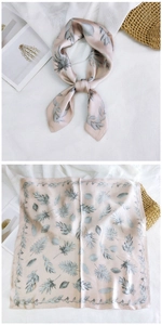 Detail of silk-feel square scarf with pale pink and grey-green leaf floral patterns