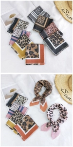 Detail of leopard print cotton linen scarves in various colors with a resort style layout
