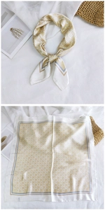 Detailed view of cream silk scarf with geometric pattern and contrasting double borders