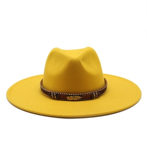 Bright yellow wide brim wool fedora hat with brown beaded band and golden feather detail