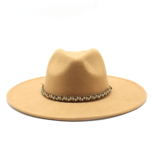 Detail of camel wool fedora with bohemian beaded band featuring turquoise and wooden accents